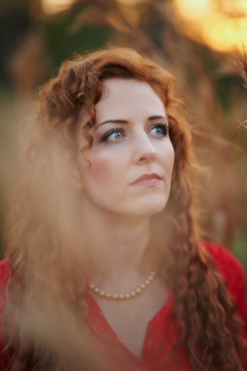 Young Elegant Woman Standing Outside