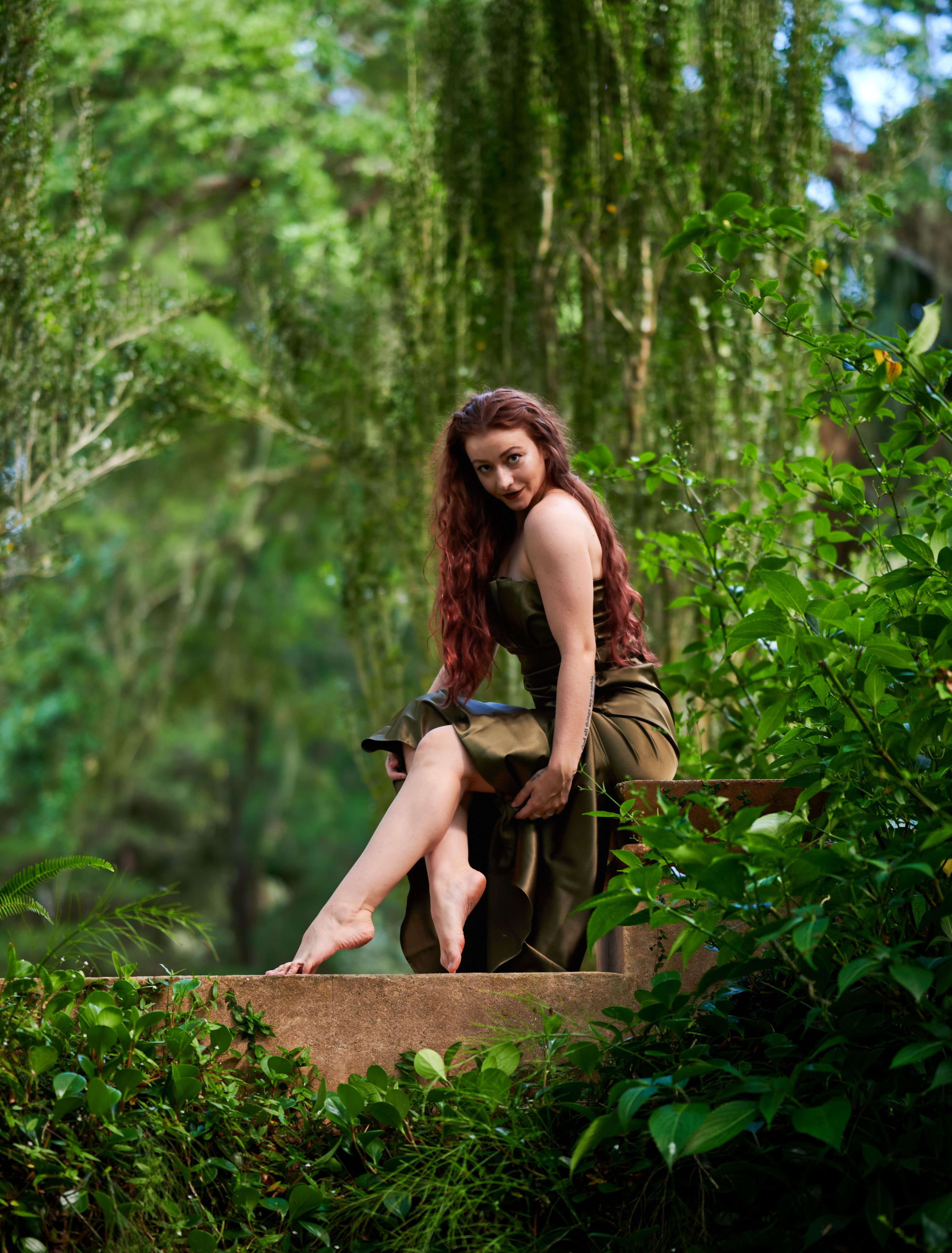 Young Woman in a Dress Posing in a Forest · Free Stock Photo