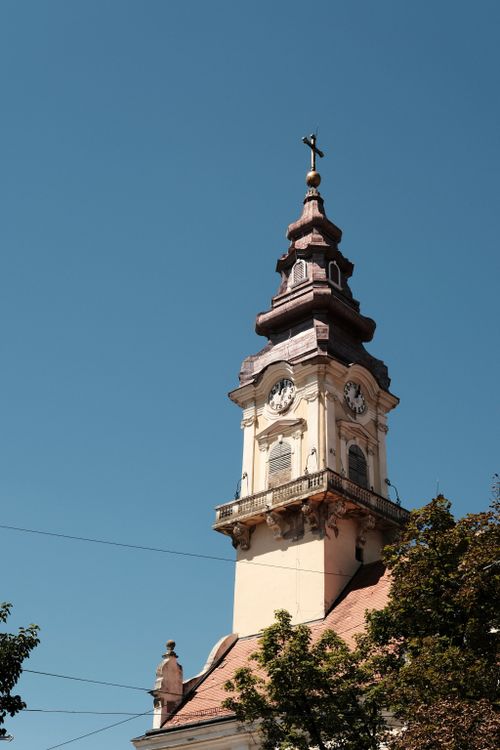 Free Elegant clock tower against a clear blue sky in Vršac, Serbia. Captivating architecture. Stock Photo