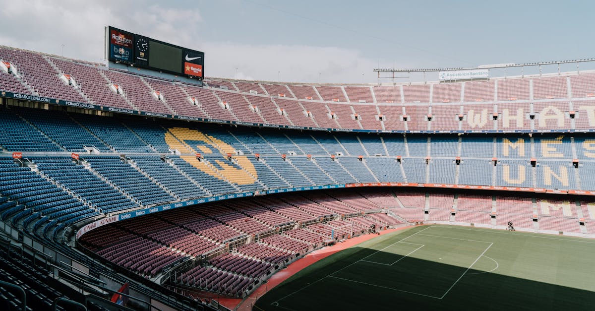 View of Camp Nou stadium in Barcelona, showcasing the iconic stands and field.