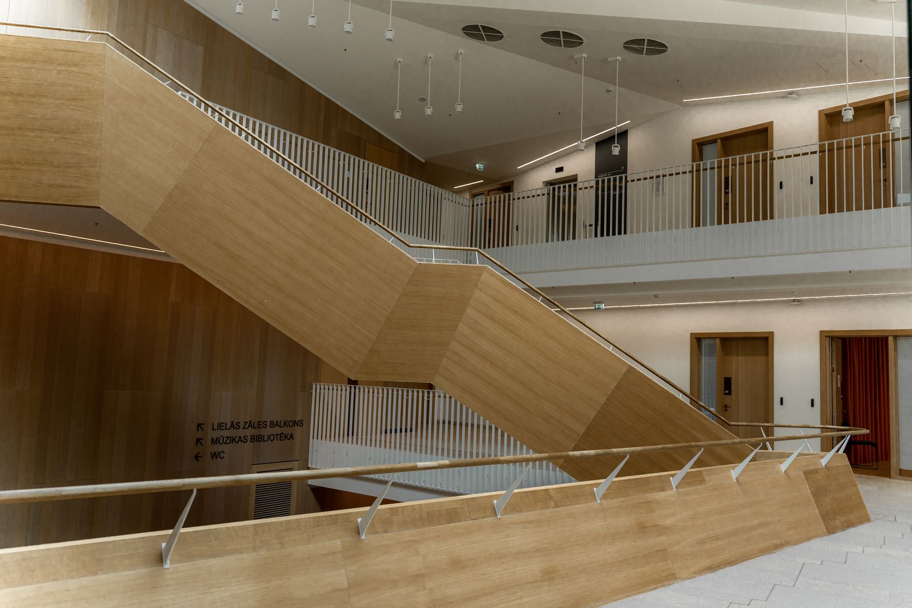 Stavanger City Library embodies Nordic design with abundant wood and natural light, creating a welcoming atmosphere.
