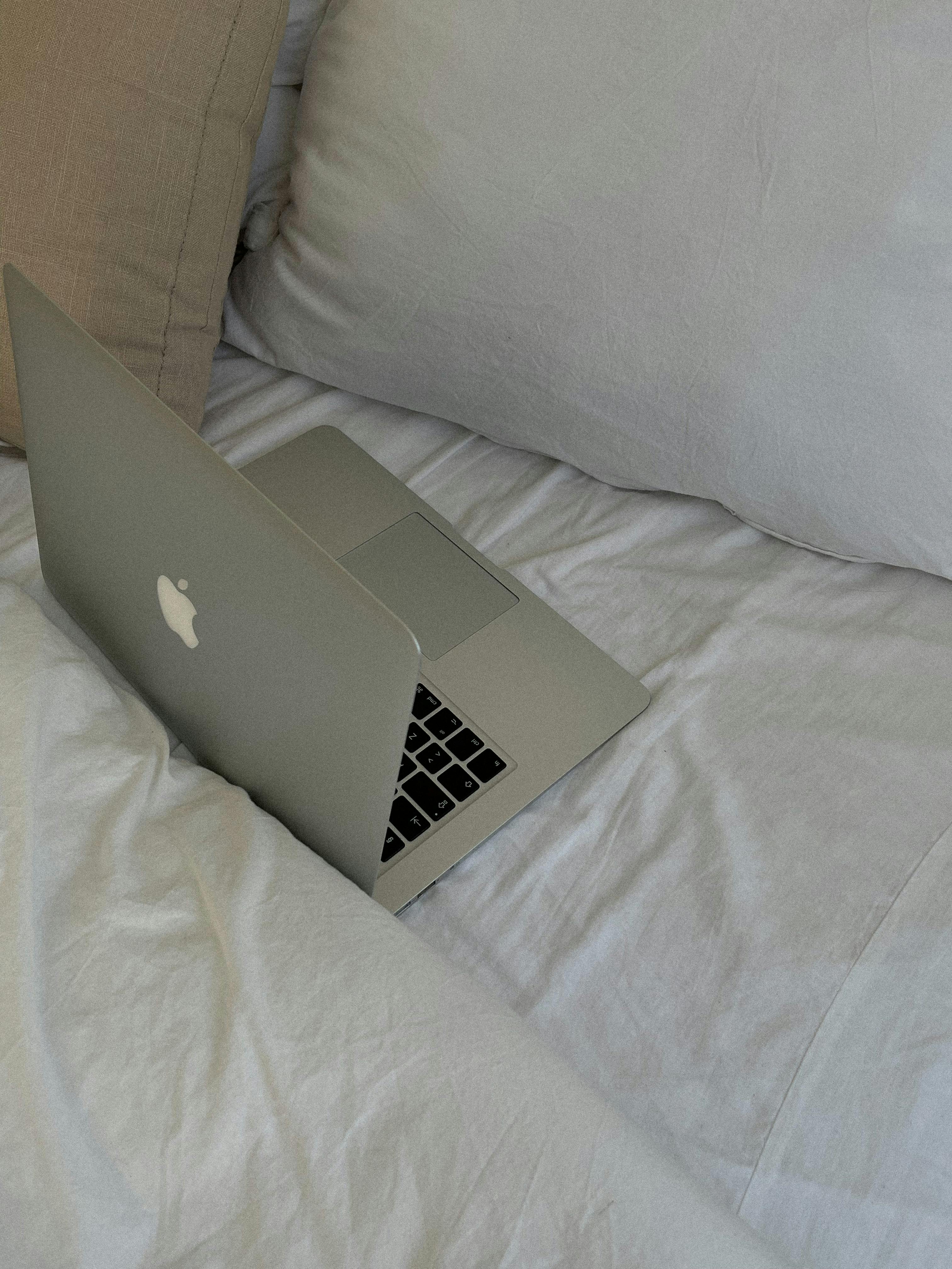 The Laptop And Computer In The Morning On A White Pillow Bed Lifestyle  Concept Stock Photo - Download Image Now - iStock