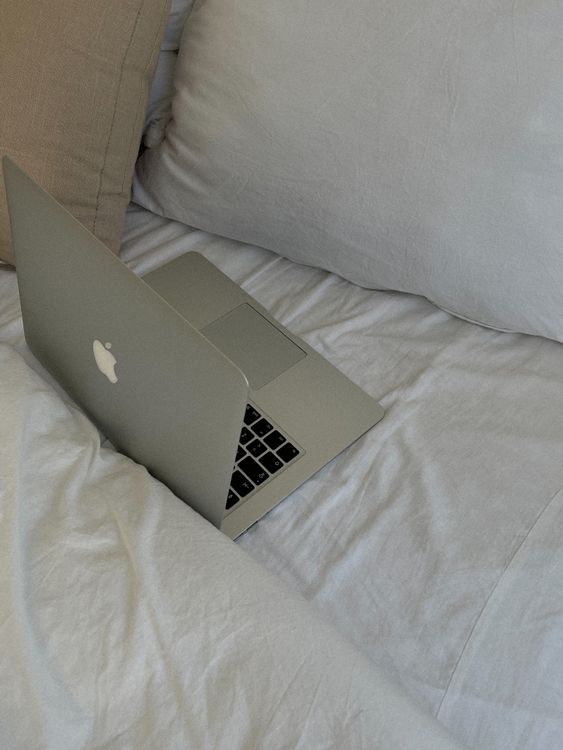 Computer On Bed Open Laptop Computer on a Bed · Free Stock Photo