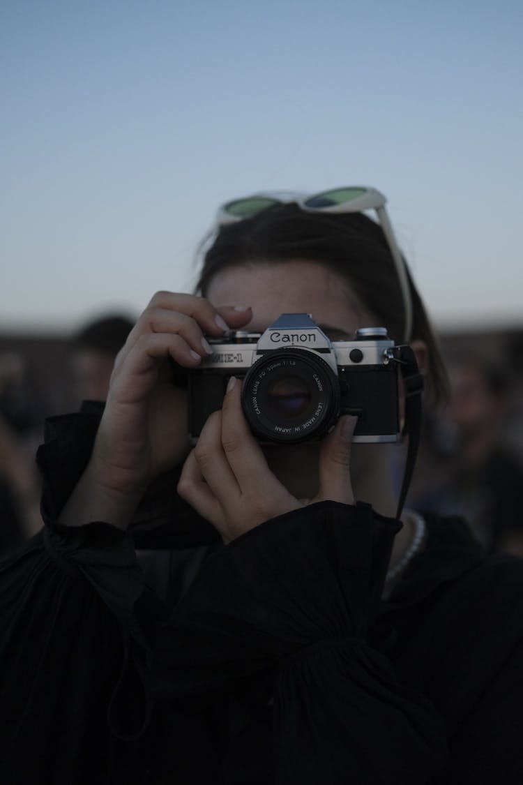 Girl Photographing With An Analogue Camera At Dusk