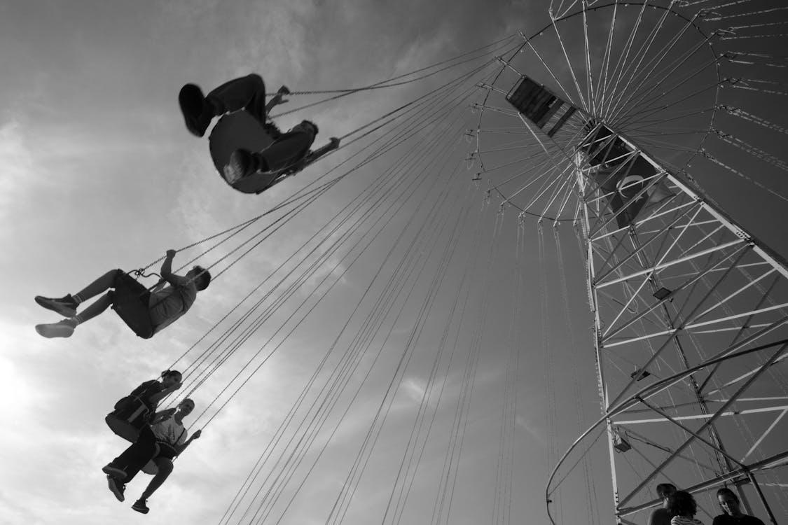 People on Swing Ride Carousel