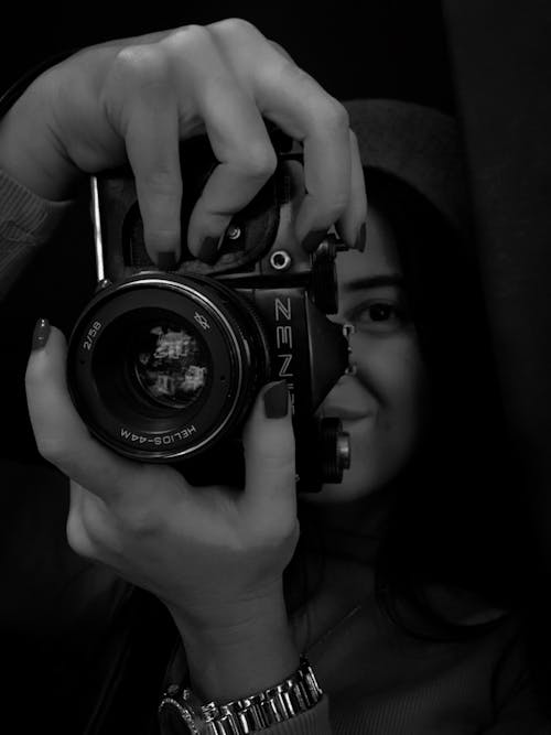Woman Holding a Camera in Black and White