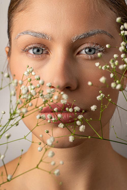 Portrait of a Young Woman with Babys Breath Flowers