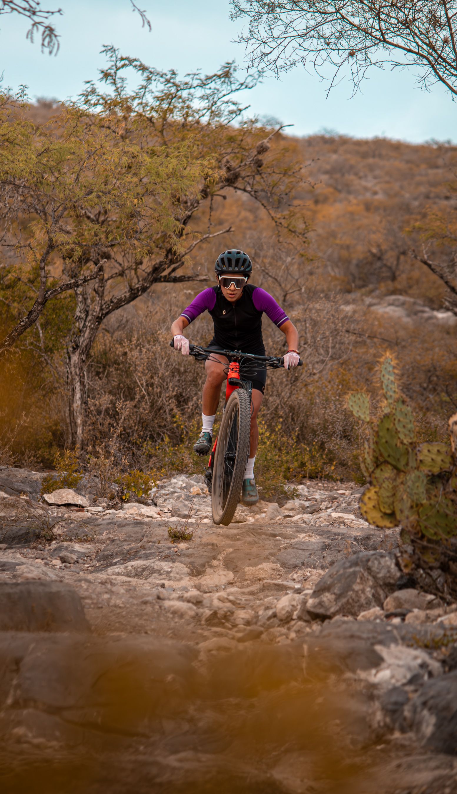 Person Riding a Bicycle on Rocks · Free Stock Photo
