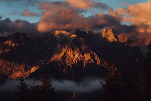 Setting Sun Illuminating Mountain Range