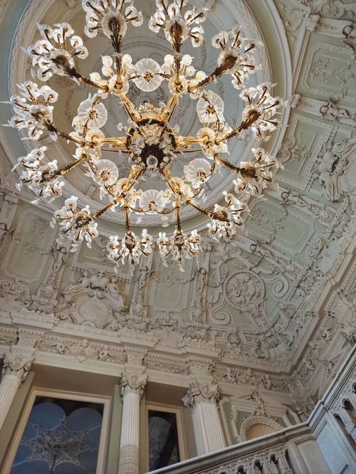 Free A grand chandelier adorns the ornate ceiling of Yusupov Palace in Saint Petersburg, Russia. Stock Photo