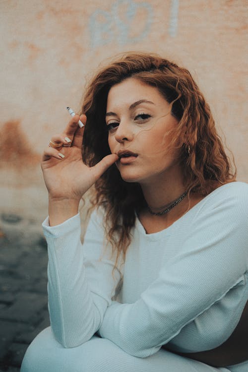 Model Smoking a Cigarette on a Break