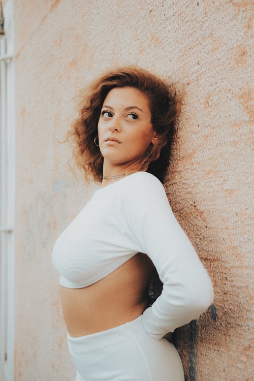 Model Wearing White Backless Crop Top with Long Sleeves