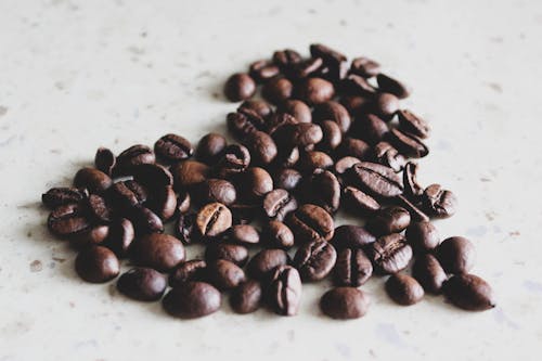 Free Coffee Beans on White Surface Stock Photo