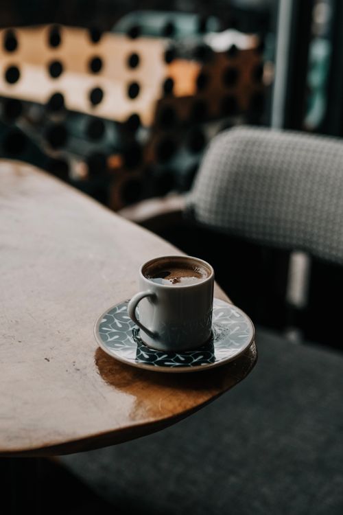 Free Elegant coffee cup on a wooden table in a cozy setting in Artvin, Türkiye. Stock Photo