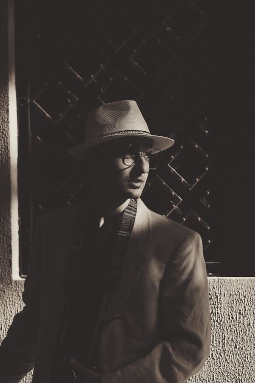 Elegant Man in a Suit and Hat Standing in front of a Building · Free ...