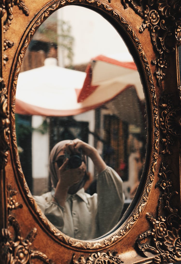 Woman Taking Selfie In Antique Mirror