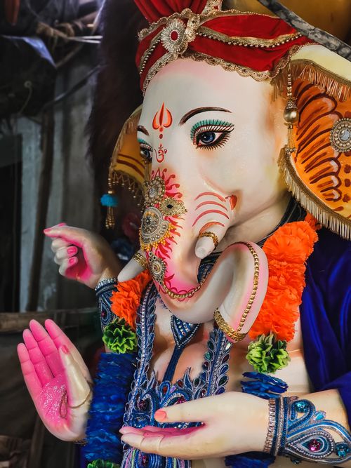 Free Vibrant depiction of the Hindu god Ganesha statue crafted in Kolkata, India. Stock Photo