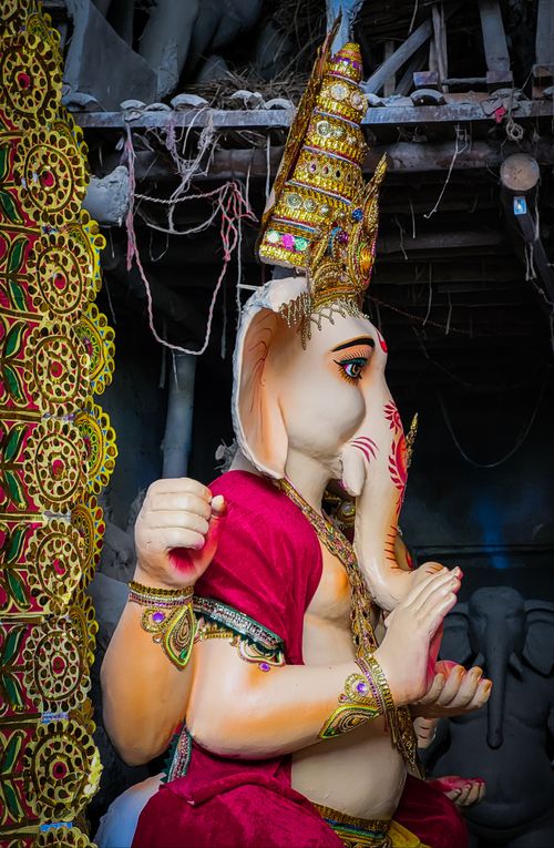 Free Detailed view of an ornate Ganesha statue in a Kolkata workshop, showcasing vibrant colors and craftsmanship. Stock Photo