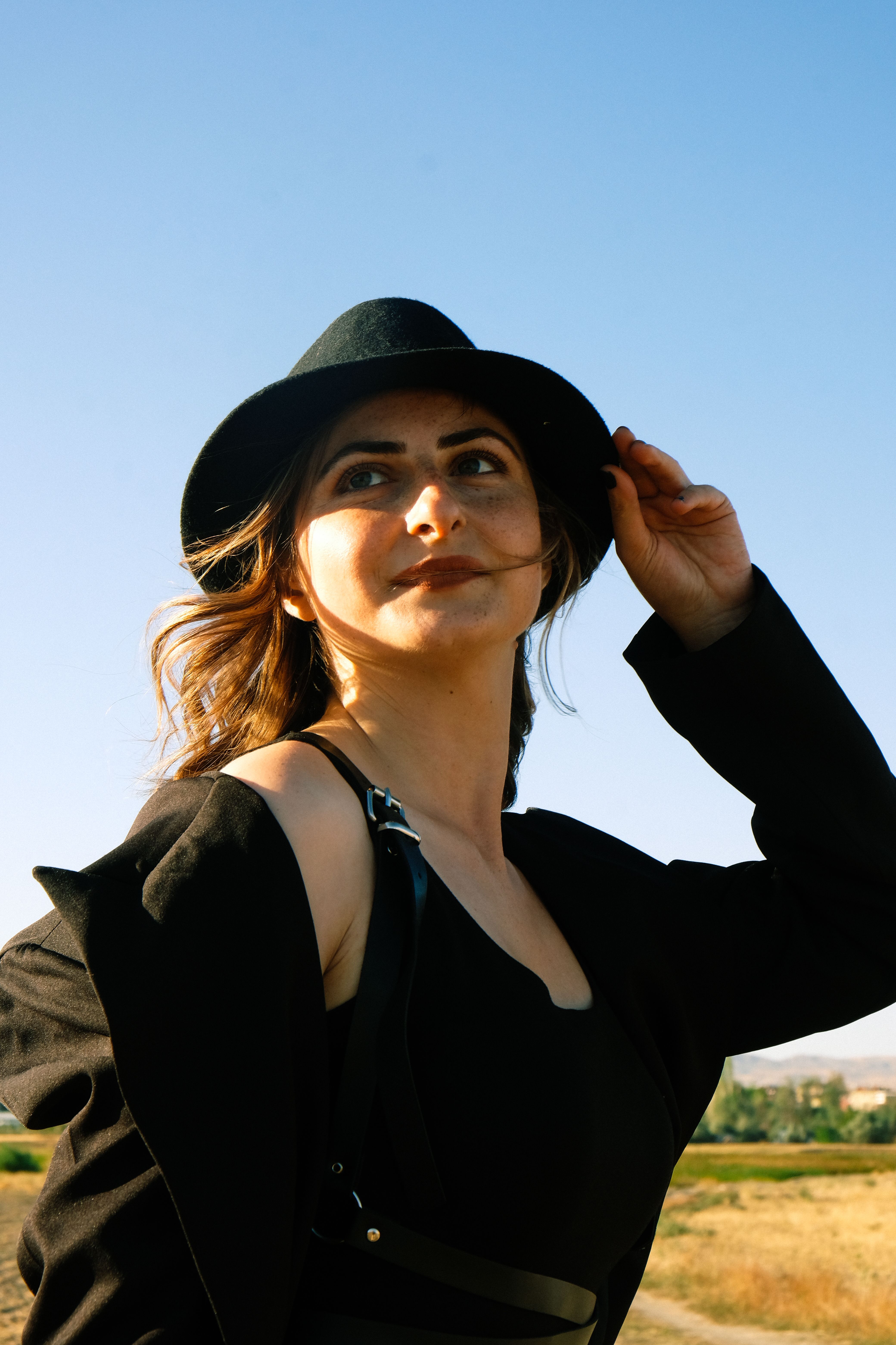 Elegant Woman in Black Jacket and Hat · Free Stock Photo
