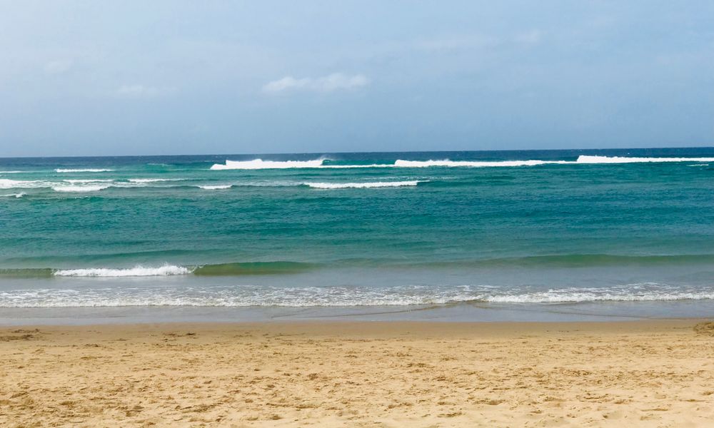pristine white sand beach turquoise water mozambique