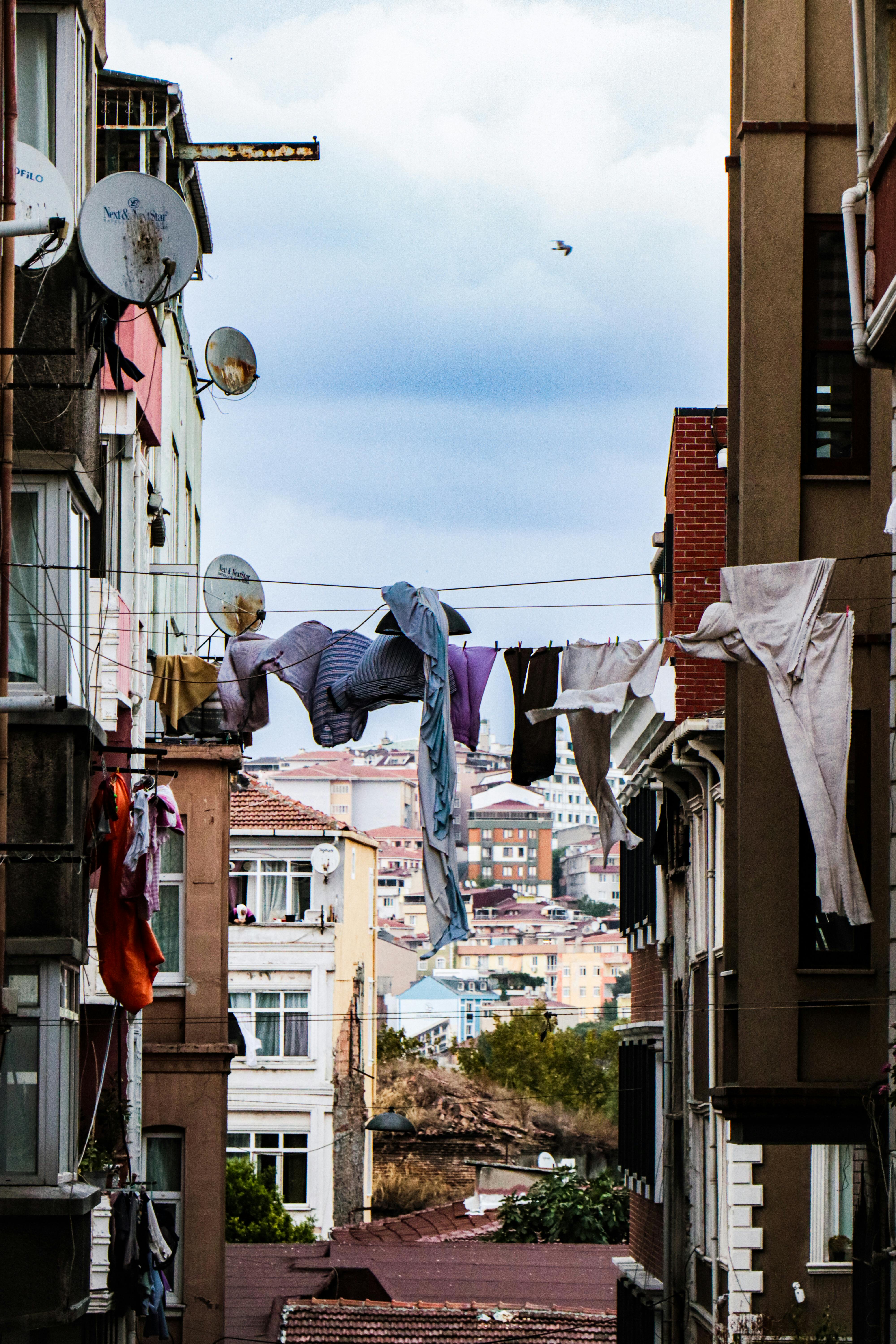 Laundry Hanging on a Clothesline between Buildings · Free Stock Photo