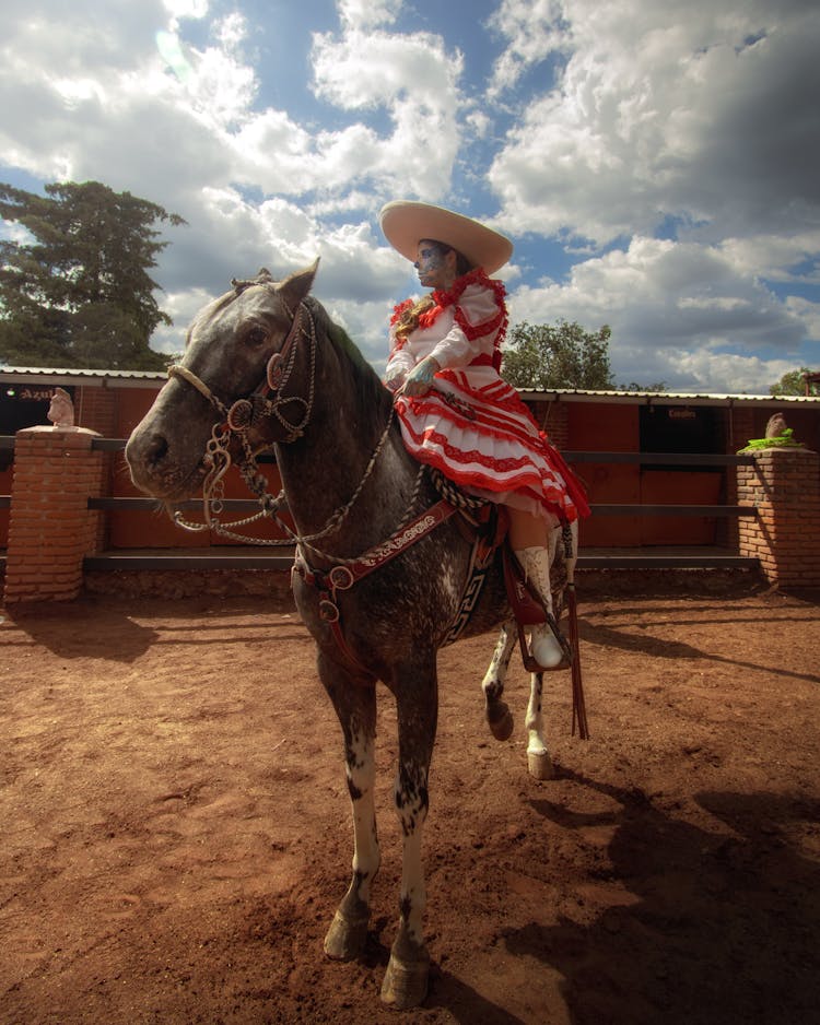 Catrina In Traditional Clothing On Horse