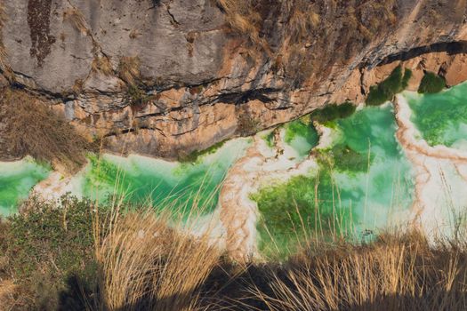 Aerial view of turquoise waters flowing through a rocky canyon in Ayacucho, Peru.