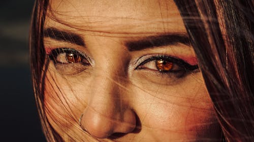 Close-Up Portrait of Beautiful Brunette Woman with Shiny Eyes