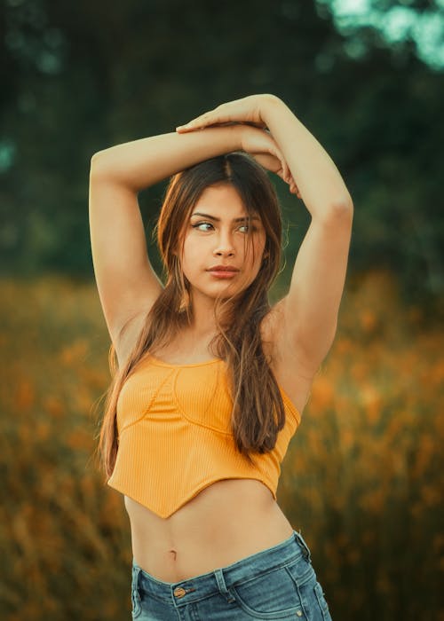 Model Posing in Orange Top 