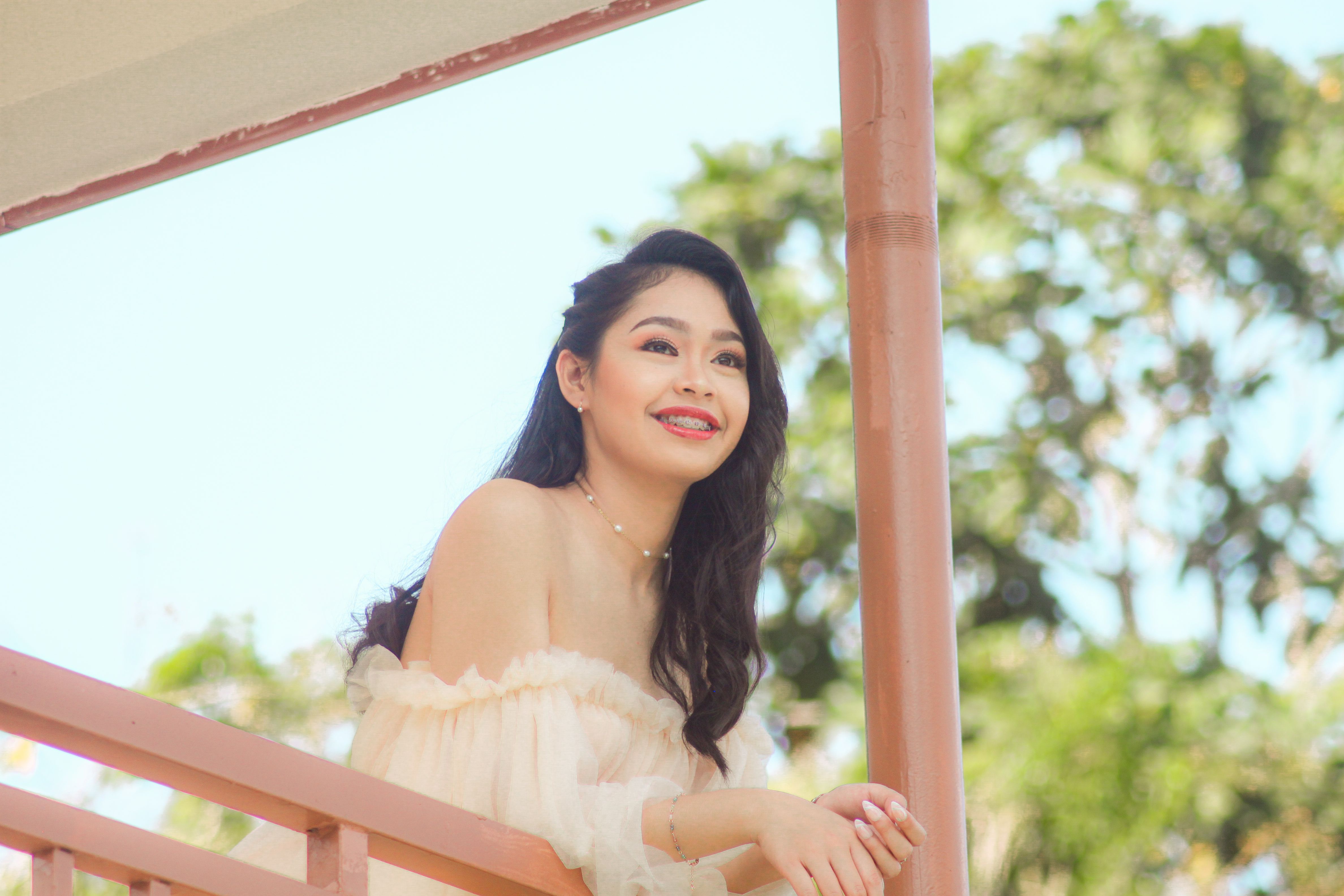 Young Brunette Woman Posing on a Terrace in Cream Off Shoulder Tulle ...