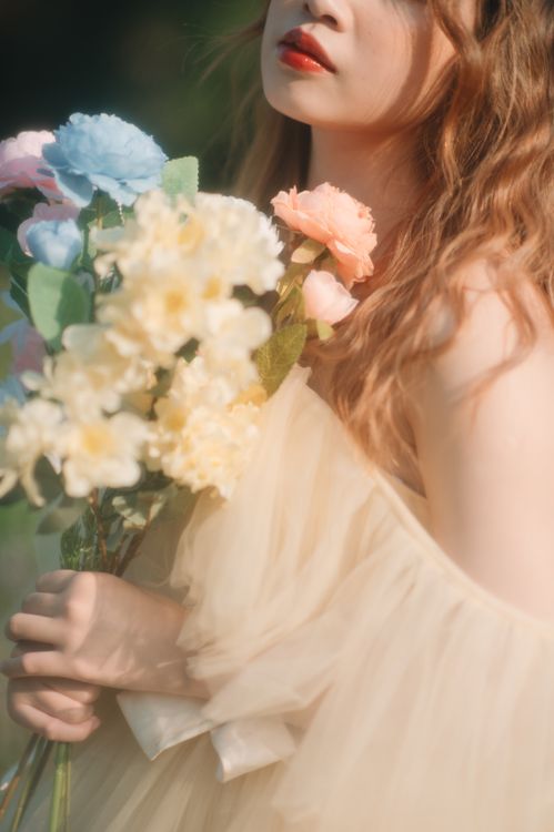 Young Woman in Beige Tulle Dress Posing with Flower Bouquet Free Stock Photo Young Woman in Beige Tulle Dress Posing with Flower Bouquet Free Stock Photo