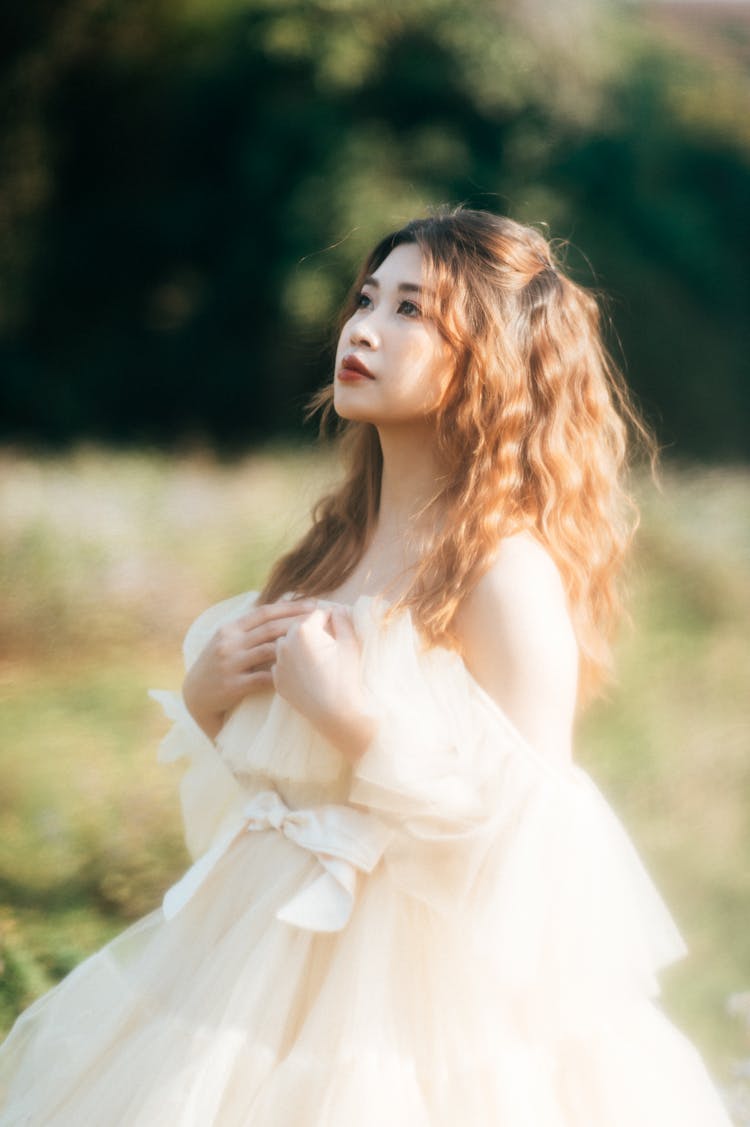 Young Woman In A Tulle Dress Posing Outside