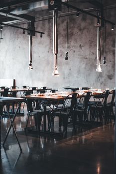 A contemporary restaurant scene featuring industrial design elements and sleek furniture. Perfect for modern culinary experiences.