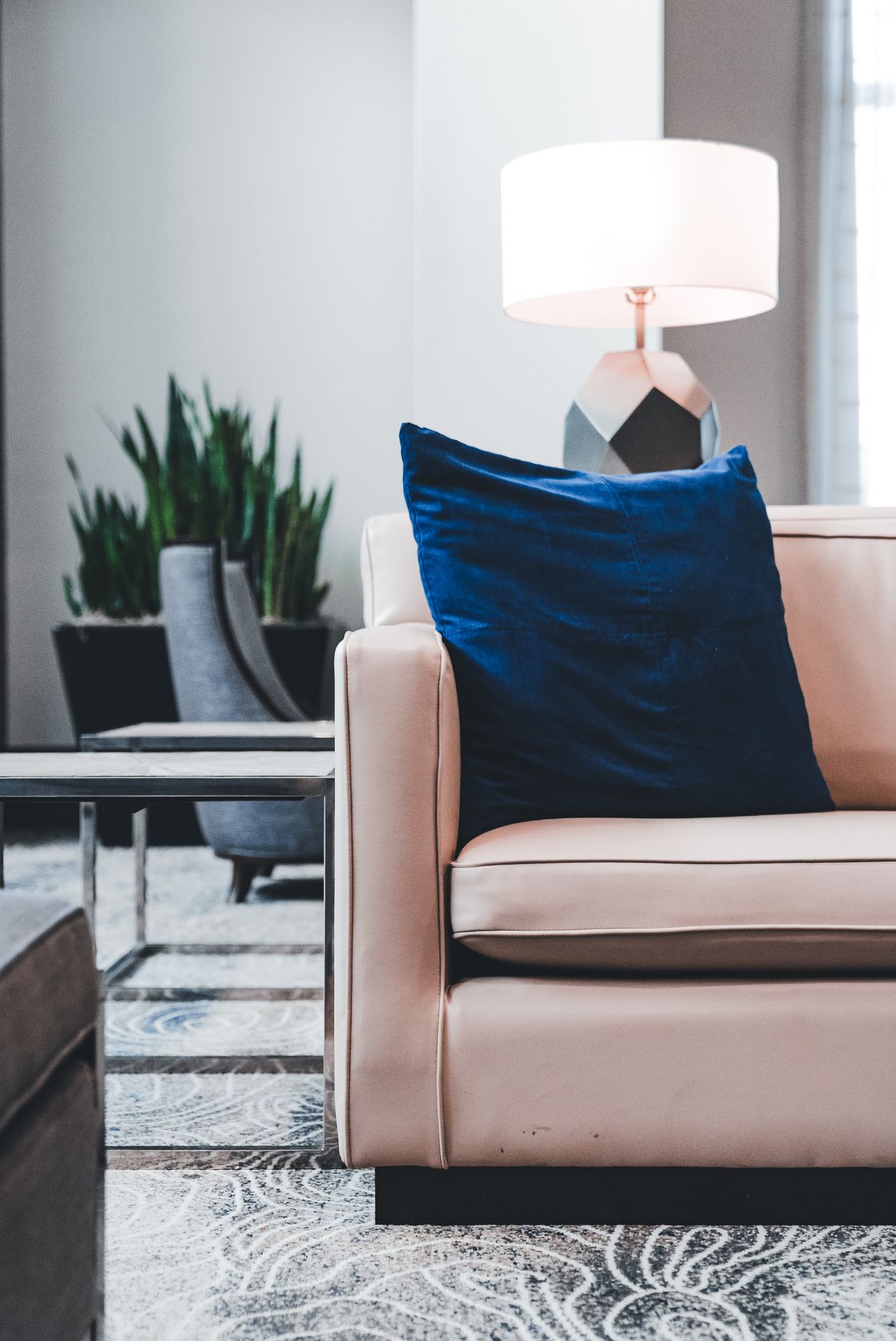 Royal blue velvet cushion on a blush pink armchair