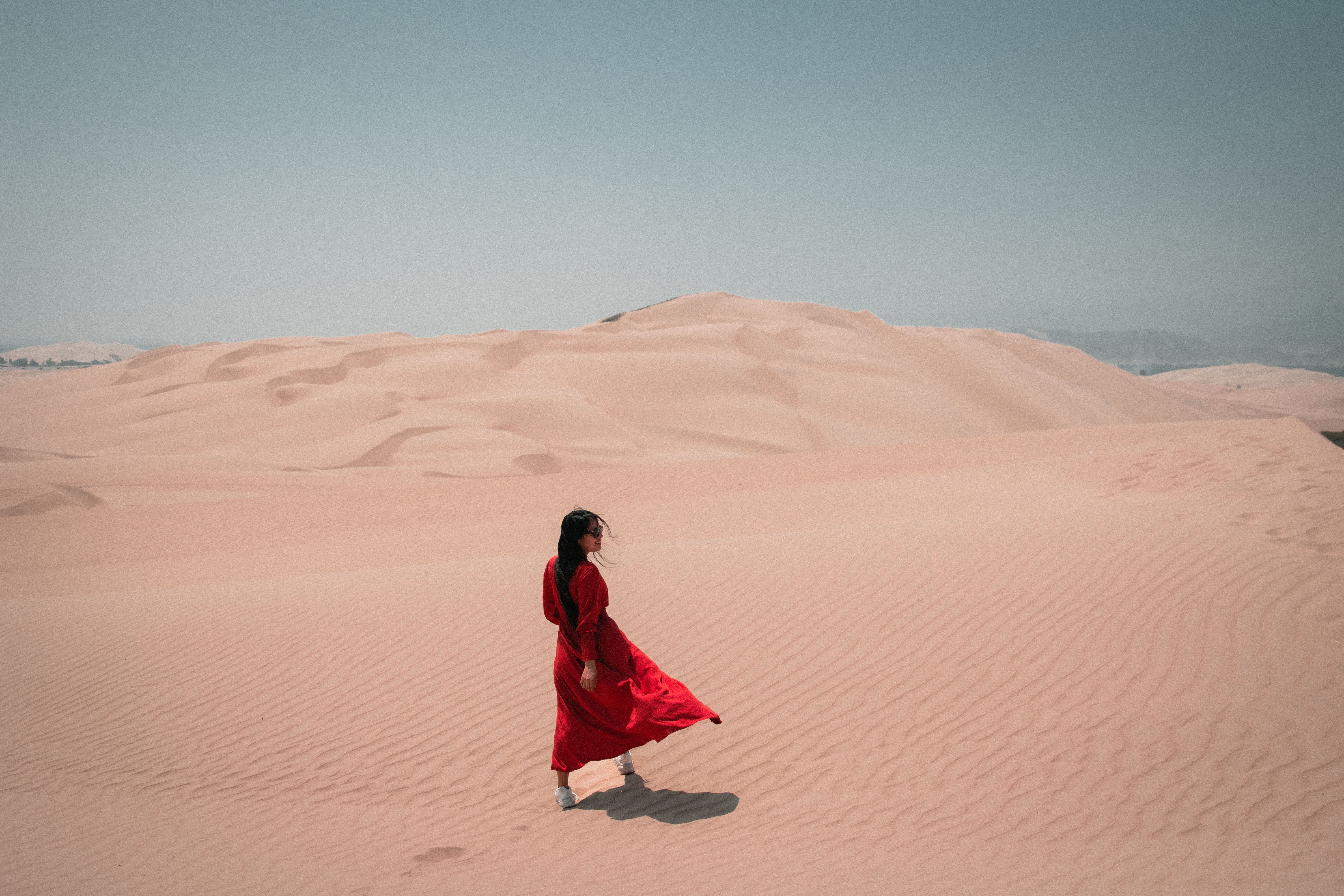 Woman in Red Dress Posing on Beach · Free Stock Photo