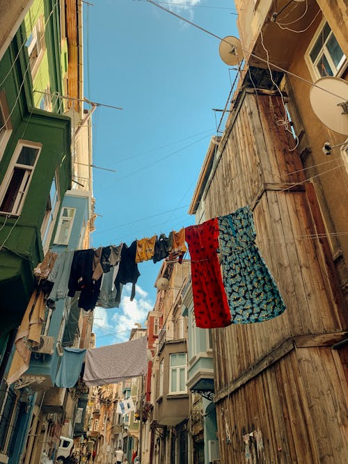 Clothes Hanging on Lines between Houses on a Narrow Street
