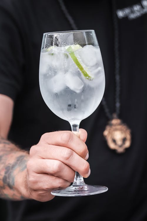 Close-up of a Man Holding a Cold Drink