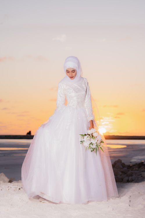 Woman Posing in Wedding Dress at Sunset · Free Stock Photo
