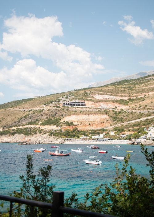 Free A serene view of boats floating in Vlorë Bay, Albania, under a clear sky. Stock Photo