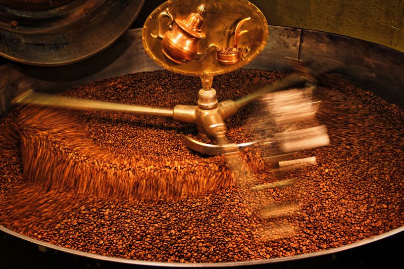 Beans turning inside a drum roaster.