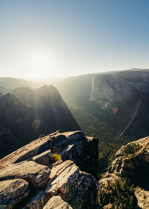 Free Captivating view of Yosemite Valley at sunset with rugged cliffs and soft sunlight. Stock Photo