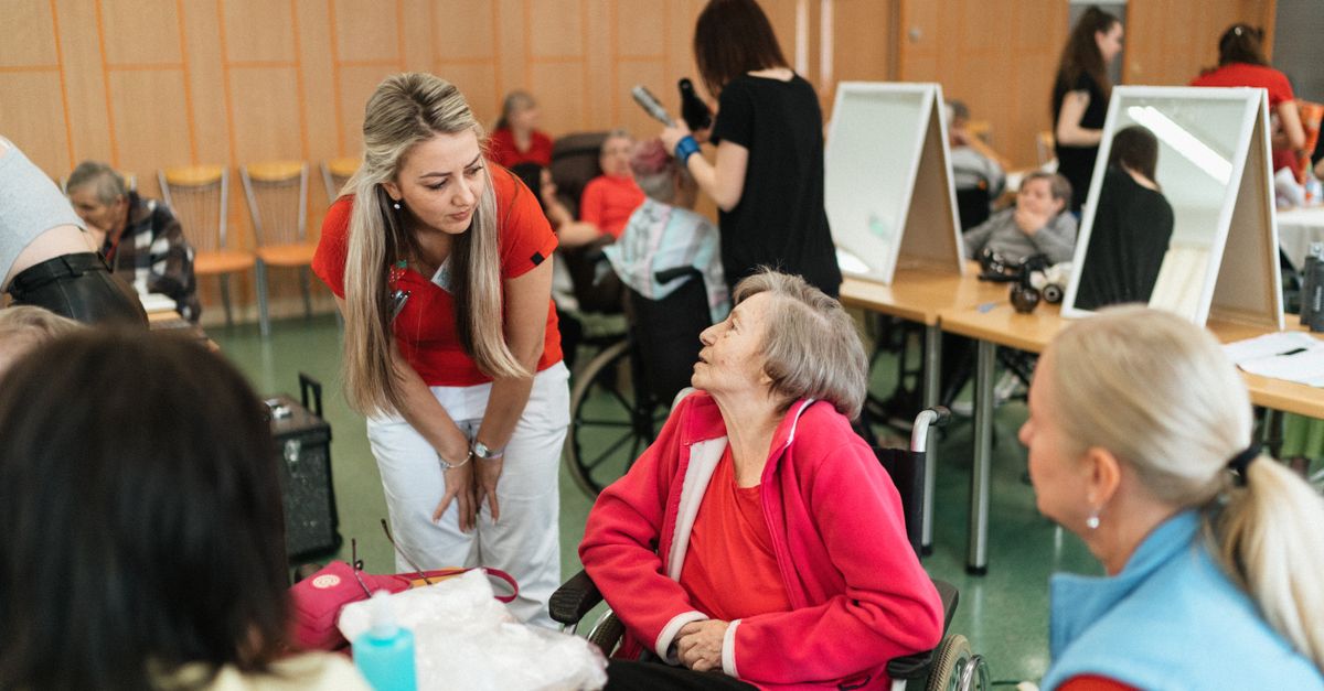 Friendly interaction between caregivers and seniors in a care facility.
