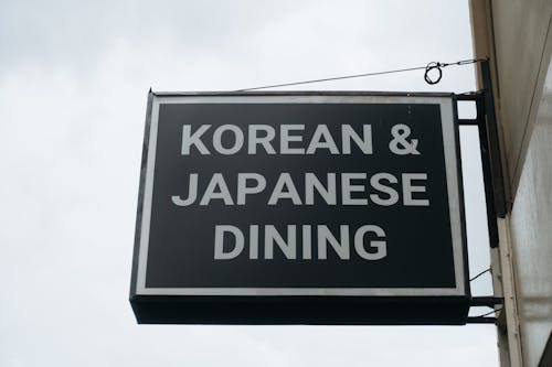 A sign that says korean and japanese dining