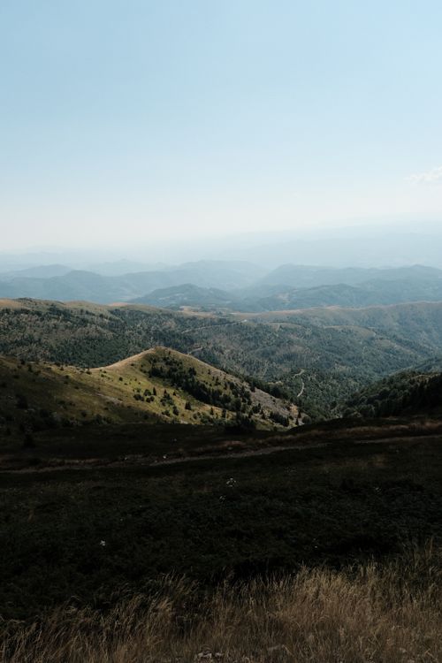 Free Explore a breathtaking view of the mountains in Kopaonik, Serbia, under a clear summer sky. Stock Photo