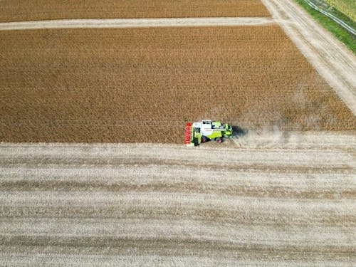 Aerial View of a Combine Harvester on a Crop