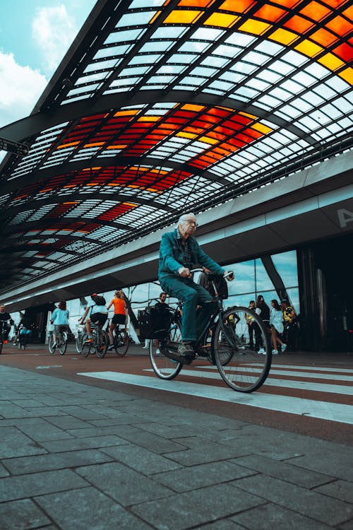 Elderly Man cycling on Bike Lane