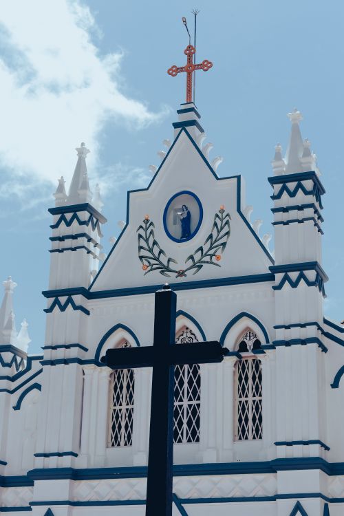 Free Stunning facade of a historic church located in Pullinkunnu, Kerala, India. Stock Photo