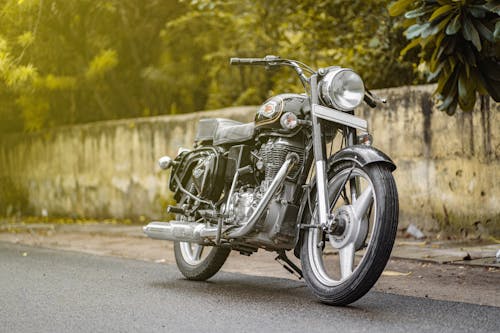 A Royal Enfield Motorcycle Parked on a Street 