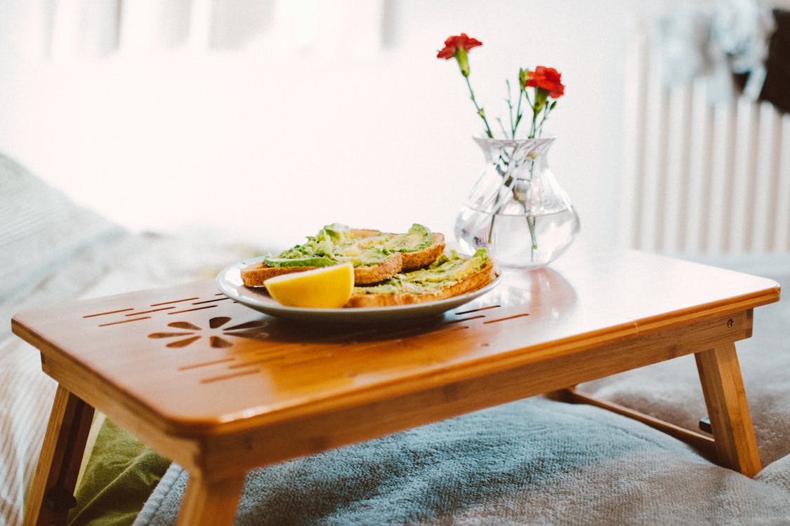 Free Food on Plant on Wooden Bed Tray Stock Photo