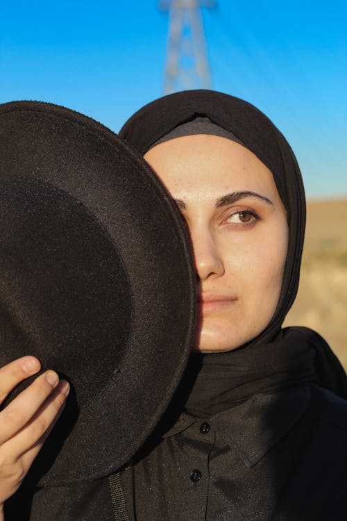 Woman in Hijab and with Hat